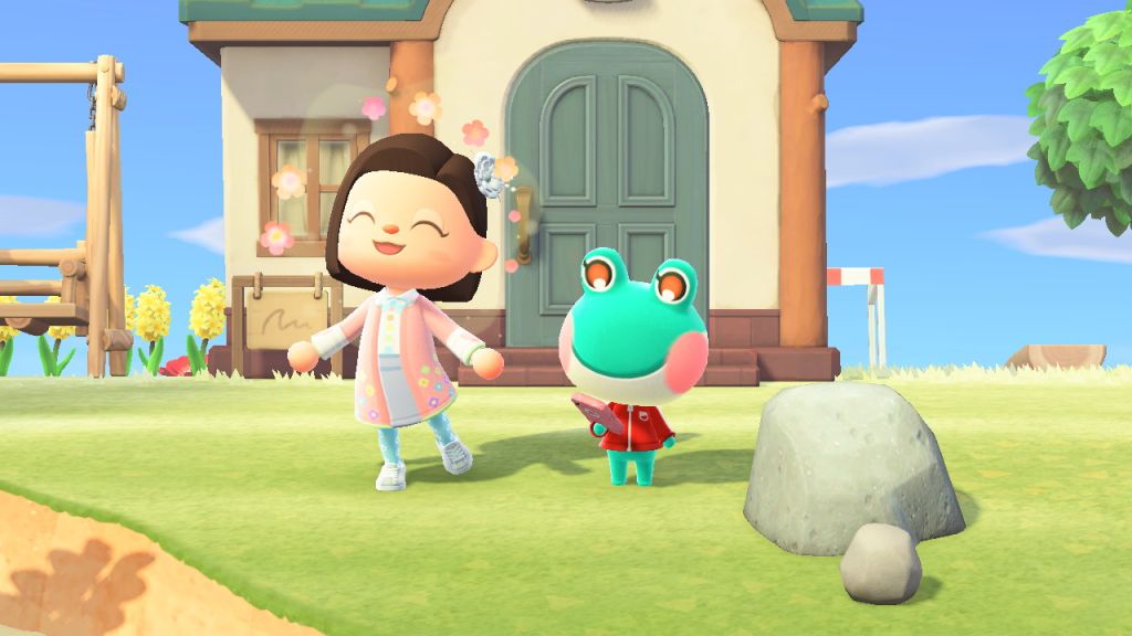 Animal Crossing, a girl being very happy next to a frog.