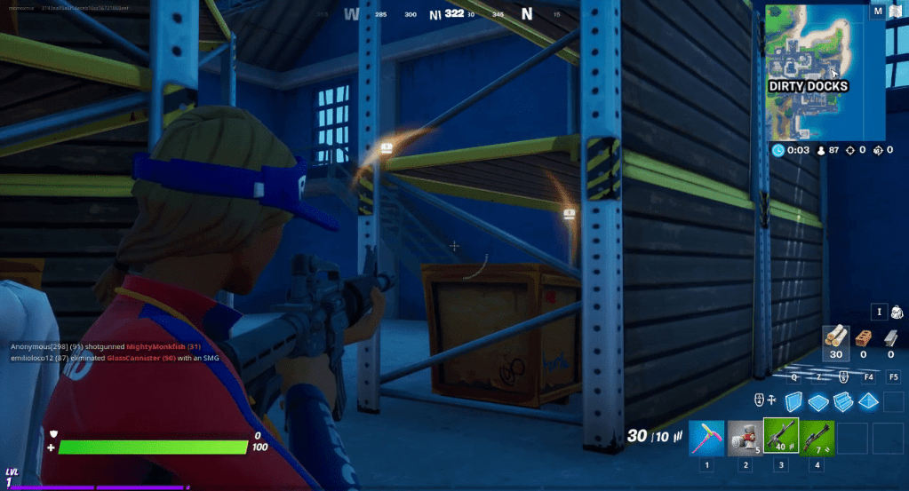 Fortnite, two yellow directional indicators with a treasure chest icon, showing a chest to the upper left and mid right.